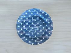 a blue plate with white stars on it