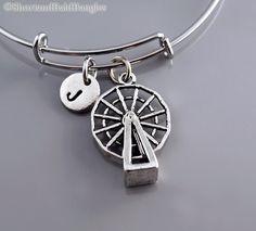 "❖ Ferris Wheel (moving) Charm: Antique Silver Pewter. Approx: 1 X 3/4\" ❖ Hand Stamped Initial Charm - Antique silver pewter 3/8\" (9mm) ❖ Bangle: Silver plated metal (Expandable) Dimension: Approx. 2.5\" (6.4 cm) - Expands to 3\" (7.6 cm) ❖ Click below for Ferris Wheel bangle in gold: https://www.etsy.com/listing/1141837106 ❖ Add a birthstone or freshwater pearl $3.50 each: https://www.etsy.com/listing/110444872 ❖ Additional Hand Stamped Initial charms $4.50 each: https://www.etsy.com/listing/ Wheel Bracelet, Thor's Hammer Necklace, Lion Necklace, Bracelet Initial, Bangle Silver, The Bangles, Silver Paint, Big Wheel, Initial Bracelet