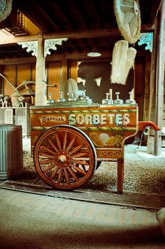 an old fashioned ice cream cart on the street