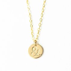 "Have you or someone in your life had a pause in your life? In a sentence a semicolon represents a momentary pause and the ampersand is the Latin symbol for and. In life there can be a pause, but what comes next? This necklace represents the pauses in life, we sometimes find ourselves in followed by the \"and\" - the what comes next. You can have pain AND joy in life. You can have trial AND blessings at the same time. You are the author of your own beautiful life story. I often wear this ampersa Meaningful Round Pendant Necklace As Best Friend Gift, Meaningful Round Pendant Necklace For Best Friend, Minimalist Round Pendant Necklace For Friendship, Minimalist Gold Necklace For Friendship, Semicolon Necklace, Initial Bar Necklace, Letter Necklace Initials, Bridesmaid Necklace Gift, Awareness Jewelry