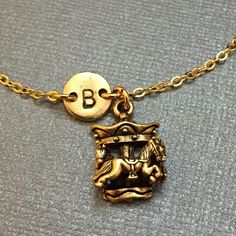 Carousel Charm bracelet with hand stamped initial.  Bracelet size is 6 1/2 inches with 2 inch extender. If you need a larger size please message me.  *Initial charm is antique gold pewter 9mm *Carousel charm is antique gold pewter *Your purchase will arrive packaged in a cute gift box and I will include a message by request. Add on a birthstone charm for $3.00 https://www.etsy.com/listing/235600956 *Go back to Toodaughters https://www.etsy.com/shop/Toodaughters Amusement Park Rides, Bracelet Initial, Cute Gift Boxes, Personalized Bracelet, Initial Bracelet, Personalized Bracelets, Birthstone Charms, Initial Charm, Gold Plated Chains