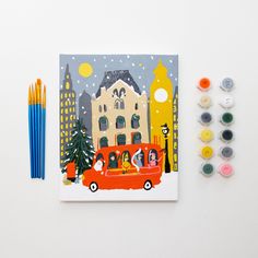 a red car driving down a street next to crayons and colored pencils