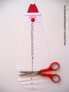 a pair of scissors sitting on top of a piece of paper with writing underneath it