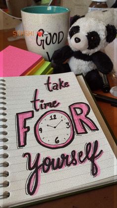 a notebook with the words take time for yourself written on it next to a stuffed panda