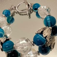 Blue onyx and glass beads bracelet made with silver colour fittings and toggle Glass Beads Bracelet, Blue Onyx, Baroque Pearl Earrings, Onyx Bracelet, Silver Colour, Glass Beaded Bracelets, Beads Bracelet, Baroque Pearls, Bracelet Making