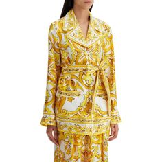 This silk twill pajama shirt, featuring the iconic majolica print, pays tribute to the rich history and exquisite craftsmanship of Italian culture. The bright lemon yellow hue and pure white accents evoke the summer light shining on the traditional Sicilian homes overlooking the sea. With its bold color detailing and feminine design, this piece effortlessly embodies the aesthetic values of Dolce&Gabbana. Don't miss the opportunity to add this belted pajama shirt to your collection, complete with Majolica Print, Makeup Travel Case, Italian Culture, Feminine Design, Light Summer, Silk Twill, White Accents, Bold Color, Pajama Shirt