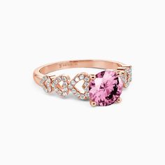 a pink ring with diamonds on it