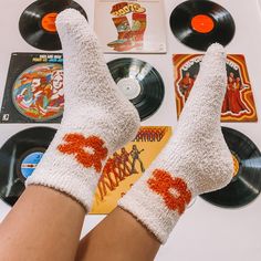 Super Fuzzy And Soft Flower Socks. White With Orange Flowers On Each Side Of Both Socks. So Adorable Peeking Out Of Shoes But Also Perfect For Keeping Your Feet Warm Inside During The Winter! Also Comes In Orange And Green. One Size Fits All (Women's 5.5 -11.5) Brand New! From My Boutique!