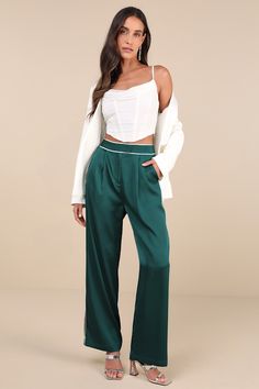 Playful and chic at the same time, the Lulus Sophisticated Step Emerald Satin Wide-Leg High-Rise Pants are essential for elevating your workweek looks! Sleek woven satin shapes these statement-making pants with a high waist, a hidden zip fly, and top clasp closures. White contrast piping accents the waist and wide legs, continuing down the side seams to ankle-length hems. Pleated details, functional front diagonal pockets, and a decorative back welt pocket complete the look. Fit: This garment fi Making Pants, Satin Pants, Chic Office, Contrast Piping, High Rise Pants, Wide Legs, Bottom Clothes, Bottoms Pants, Welt Pocket