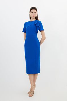 {@@=Ist.Core.Helpers.StringHelper.ToProperCase("A classic straight midi dress is elevated with ruffle detailing along a round neck and short sleeves. Tailored with premium crepe and cut with a pencil fit, pair with golden heels and accessories for a sophisticated ensemble.Round neckRuffle detailingShort sleevesExpertly designed for those 5'3" and under, our Petite pieces are perfectly proportioned for a smaller frame using shorter lengths.")} Formal Short Sleeve Midi Dress With Ruffles, Short Sleeve Ruffled Dresses For Office, Formal Ruffled Sheath Bodycon Dress, Knee-length Ruffled Midi Dress For Work, Formal Ruffle Sleeve Midi Dress, Fitted Midi Dress With Ruffle Sleeves For Work, Ruffle Sleeve Midi Dress For Formal Occasions, Knee-length Midi Dress With Ruffles For Work, Formal Midi Dress With Ruffle Sleeves