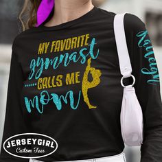 Show your love for your favorite gymnast with our "My Favorite Gymnast Calls Me Mom" long sleeve shirts! Personalize the sleeve of your "My Favorite Gymnast Calls Me Mom" shirt with your gymnast's name. Choose your glitter colors to match your gym's colors. Or change the wording to customize this glitter gymnastics shirt however you choose! Enter your personalization under "Add your personalization." Front: specify any changes to the wording, "My Favorite Gymnast Calls Me Mom," if applicable. Sleeve: enter the gymnast's name exactly as it should appear on the sleeve. If entering more than one gymnast's name, the first name with appear on left sleeve, and the second name will appear on the right sleeve. Enter 2 glitter design colors: 1 glitter color for "gymnast" and "mom" on the front, and Long Sleeve Workout T-shirt With Letter Print, Workout Long Sleeve Tops With Letter Print, Long Sleeve Workout Tops With Letter Print, Long Sleeve Workout Tops With Text Print, Pre-shrunk Long Sleeve Cheerleading Sweatshirt, Pre-shrunk Long Sleeve Sweatshirt For Cheerleading, Long Sleeve Sports Top With Name Print, Workout Long Sleeve T-shirt With Letter Print, Long Sleeve Letter Print Workout T-shirt