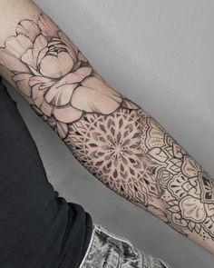 a person with a flower tattoo on their arm