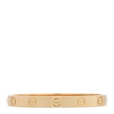 This is an authentic CARTIER 18K Yellow Gold LOVE Bracelet size 15. The bracelet is crafted of 18 karat yellow gold and features a bangle with the signature LOVE screw symbol motifs engraved throughout. The bracelet also features two functional screws on either side to open and close. Gold Love Bracelet, Love Bracelet, Love Bracelets, Bracelet Sizes, Cartier, Screw, Bangles, Yellow Gold, Bracelet