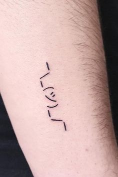 a man's arm with the word love written in cursive writing on it