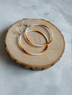 Check out this item in my Etsy shop https://www.etsy.com/listing/809173735/large-beaded-hoop-earrings-black-hoop Beaded Hoop Festival Jewelry, Beaded Hoop Jewelry For Festivals, Bohemian White Beaded Hoop Earrings, Bohemian Heishi Beads Small Hoop Earrings, Bohemian Heishi Beads Hoop Earrings, Bohemian Small Hoop Heishi Bead Earrings, White Hoop Earrings For Festival, Adjustable White Hoop Earrings For Festivals, Festival Hoop Earrings With Tiny Beads