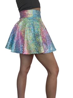 Introducing our stunning Rainbow Ombre Holographic Skater Skirt, inspired by Taylor Swift's iconic Lover outfit and designed for the ultimate music festival and rave experience. Crafted with care in the USA, this skirt combines captivating style with unmatched quality to ensure you make a bold statement on the dance floor.Crafted from high-quality stretchy rainbow avatar spandex, this skirt offers a comfortable and flexible fit that allows you to move freely and dance with ease. The flattering s Fitted Mini Skirt For Concert, Festival Dance Skirt, Fitted, Festival Fitted Skirt For Dance, Fitted Festival Skirt For Dance, Fitted Skirt For Dance Festivals, Spring Rave Bottoms For Club, Rave Bottoms For Club In Spring, Spring Club Rave Bottoms, Spring Rave Club Bottoms