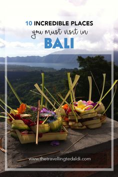 baskets filled with flowers sitting on top of a stone wall next to the words 10 incredible places you must visit in bali