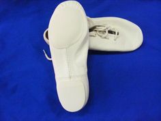 Theatricals J002W Adult Size 3.5M White Lace Up Jazz Shoe Split-sole design hugs the arch to enhance the line and to give ultimate flexibility. Manufactured on a new last for superb fit. Newly-developed leather is lightweight and flexible with a soft hand and a rich appearance. Eva sole and heel are engineered to provide traction without inhibiting turns. Suede leather sock lining designed for flexibility and control while the cotton lining absorbs perspiration. View more great items Jazz Shoes, The Arch, Leather Socks, Eva Sole, Soft Hands, Soft Hand, Line Design, The Line, White Lace