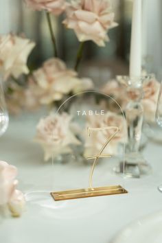 the table is set with flowers and candles