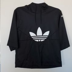 Brand New, Never Worn, Unique With A High Collared Neck W/Hood & Mid Length Sleeves. Baggy 90's Feel. Unisex Nwot Adidas Sporty Streetwear Tops, Athleisure Hooded Top For Streetwear, Black Urban Sweatshirt, Black Urban Style Sweatshirt, Adidas Sweatshirt For Fall Streetwear, Adidas Fall Streetwear Sweatshirt, Adidas Hoodie For Spring Streetwear, Adidas Hoodie For Streetwear In Spring, Adidas Sporty Winter Tops