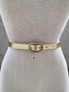 Vintage Karl Olsen gold tone leather belt, thin golden belt, made in Britain, Dorset fashion accessories, shiny metallic gold, designer belt This Vintage Karl Olsen Gold Tone Leather Belt is a timeless piece of British fashion accessory that exudes sophistication and elegance. Crafted with meticulous attention to detail, this belt features a thin golden belt made of leather and finished in a shiny metallic gold tone that adds a touch of opulence to any outfit. The designer behind this exceptional belt, Karl Olsen, is widely known for his mastery in creating stunning leather accessories that embody quality, style, and durability. With a keen eye for design, Olsen has established himself as one of Britain's most celebrated fashion accessory designers, with a reputation for delivering top-not Golden Belt, Designer Belt, British Fashion, Suspender Belt, Gold Leather, British Style, Leather Accessories, Metallic Gold, Timeless Pieces