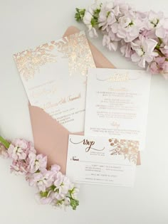 wedding stationery with pink flowers and gold foil