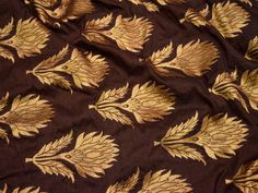 Brown Brocade fabric by the Yard Sewing Indian Making Wedding Dress Banarasi Fabric Crafting Banaras fabric Bridal lehenga Material Fabric. This is a beautiful banarasi blended silk brocade floral design fabric in Brown and Gold. ➤Product: Brocade Fabric ➤Fabric Type: Blended Silk (Viscose and Silk) Fine quality Zari Brocade Weaving from Banaras ➤Color: Brown and Gold ➤Width: 44 inches. ➤Condition: New ➤ Code: bg1442 ➤Listing for 1 Yard of fabric. ➤Care: Dry Clean Only You can use this fabric to Brocade Embroidered Dupatta Fabric For Reception, Gold Jamawar Dupatta For Reception, Embroidered Art Silk Fabric With Motifs For Receptions, Gold Unstitched Suit For Reception And Diwali, Chanderi Dupatta With Motifs For Reception, Traditional Brocade Saree For Reception, Brocade Choli With Motifs For Reception, Festive Brocade Embroidered Fabric For Anarkali, Festive Brocade Embroidered Anarkali Fabric