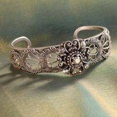 "Created from original vintage tools and dies, this bracelet has the appearance of the finest Spanish lace. A stunning bracelet for brides, bridesmaids, wedding party and Mother of the Bride. Fabricated by hand and torch, one delicate panel at a time is secured around the open cuff. Size: 7\" Made in our Los Angeles, CA studio. Contact us for bulk pricing and wholesale information." Formal Cuff Bracelet With Intricate Design, Heirloom Cuff Bracelet With Intricate Design For Formal Occasions, Victorian Filigree Bangle, Victorian Style Engraved Wedding Bracelets, Vintage Metal Jewelry With Intricate Design, Art Deco Wedding Bracelet With Intricate Design, Ornate Engraved Cuff Bracelet For Wedding, Vintage Wedding Bracelets With Intricate Design, Victorian Bracelets For Anniversary