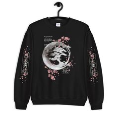 Japanese Blossom Sweatshirt, Cherry Blossom Moon Crescent Hoodie, Aesthetic Sweatshirt, Kawaii, Flowers Anime Unisex Sweatshirt A sturdy and warm sweatshirt bound to keep you warm in the colder months. A pre-shrunk, classic fit sweater that's made with air-jet spun yarn for a soft feel and reduced pilling. * 50% cotton, 50% polyester * Pre-shrunk * Classic fit * 1x1 athletic rib knit collar with spandex * Air-jet spun yarn with a soft feel and reduced pilling * Double-needle stitched collar, sho Harajuku Style T-shirt For Winter Streetwear, Harajuku Style Graphic Print Winter Sweatshirt, Harajuku Style Sweatshirt For Spring Streetwear, Kawaii Hooded Sweatshirt With Graphic Print, Oversized Anime Print Sweatshirt, Black Harajuku Sweatshirt For Spring, Black Harajuku Style Sweatshirt For Spring, Oversized Anime Print Casual Sweatshirt, Casual Oversized Anime Print Sweatshirt