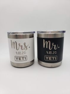 two personalized yeti coffee mugs with the words mr and mrs on them