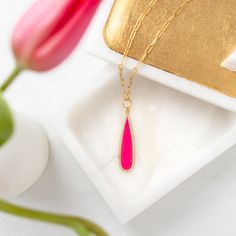 This beautiful necklace features a long pink teardrop pendant with a pave border, accented on a paperclip chain. 18" Plated Brass Enamel Cubic Zirconia Pink Paperclip Chain Necklace, Pink Teardrop Pendant Drop Necklace Gift, Linen Casual, Pave Pendant, Multi Layering, Paper Clip, Earring Gifts, Ring Necklace, Gift Necklace