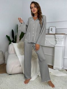 Elevate relaxation with our 2-piece Contrast Binding Casual Lounge Set. Effortless style meets comfort in this knitted polyester ensemble. Express yourself in a plain pattern with pocket and button front details. Loose fit & medium stretch ensure all-day ease. Long sleeves for extra coziness. Easy care with machine wash or dry clean. Unwind fashionably. Features: Style: Casual-Comfy Pattern Type: Plain Type: Pant Sets Details: Pocket, Contrast Binding, Button Front Sleeve Length: Long Sleeve Fit 2024 Wardrobe, Pant Sets, Stretch Top, Lounge Set, Shoulder Sleeve, Effortless Style, 2 Piece, Pants Set, Style Casual