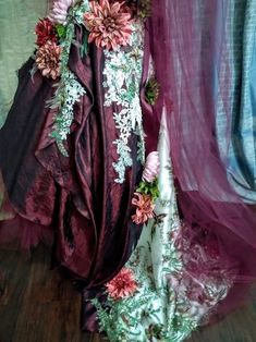 a dress made out of fabric and flowers