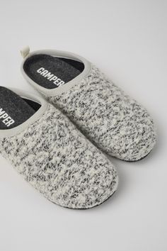 White and black wool women’s slipper. With removable EVA insole and rubber outsole.Our iconic Wabi slipper inspired by Japanese minimalism is designed with fewer components to help reduce environmental impact. So cozy you'll never want to take them off. Japanese Minimalism, Camper Shoes, Outdoor Slippers, Style Reference, Shoes Heels Wedges, Slipper Sandals, Boots And Sneakers, Environmental Impact, Shoe Care