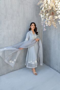 SKU: 2206 Price for Shirt, lining & Pants The iridescent and resplendence of dusty gray come together to create this stunning ensemble, rendered in soft silk fabric festooned with pearls, crystals and Hand worked florals. This ensemble comes with organza dupatta embellished with delicate details of laces an pearls with hand made florals. Dupatta as is can be added. Elegant Gray Set With Dupatta, Elegant Gray Festive Sets, Elegant Gray Sets For Eid, Designer Work Dresses, Pakistani Designer Dress, Dusty Gray, Pakistani Wedding Dress, Desi Clothes, Organza Dupatta