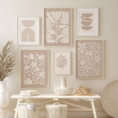 a white table topped with pictures and vases