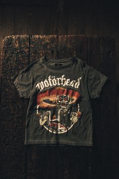 It’s time to play the game!

We’ve teamed up with Motorhead to recreate some of their most iconic designs from the early years, we’ve dived deep into the archive to bring back some of the earliest & rarest designs including the ‘Another Perfect Tour’ & ‘Biker’ artworks.

Every T-shirt has been individually treated to create a unique and one off product, all hand washed, printed, distressed, aged, beaten, blasted & burned here in our UK studio using our signature blend of authentic vintage plasti Band Merch T-shirt With Vintage Print For Streetwear, Vintage Washed Black T-shirt For Concert, Retro Washed Black Top With Graphic Print, Retro Washed Black Tops With Graphic Print, Retro Washed Black Screen Print T-shirt, Washed Black Punk T-shirt With Graphic Print, Retro Distressed Washed Black T-shirt, Retro Washed Black T-shirt With Screen Print, Punk Style Washed Black T-shirt With Graphic Print