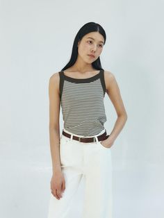 This is a trendy and modern top by MOHAN that is made out of high quality and sturdy material. With distinctive mood of the design and comfortable wear, you can style it for your casual daily outfit.- Fabric with high elasticity- Clean and casual stripe pattern overall- Minimal and feminine mood Trendy Striped Vest For Spring, Chic Striped Summer Vest, Chic Cotton Tops With Contrast Stripes, Chic Fitted Tops With Contrast Stripes, Fitted Tops With Vertical Stripes For Summer, Casual Striped Sleeveless Vest, Striped Stretch Tank Top For Summer, Fitted Top With Contrast Stripes For Summer, Chic Fitted Top With Contrast Stripes