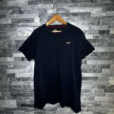 Navy Blue Hollister T-Shirt Size: Large Never Worn Without Tags Navy Crew Neck Graphic Tee, Navy Graphic Tee With Short Sleeves, Navy Casual Crew Neck Top, Casual Navy Crew Neck Top, Navy Graphic Tee With Crew Neck, Navy Graphic Tee Shirt With Crew Neck, Navy Casual Crew Neck T-shirt, Casual Navy T-shirt With Crew Neck, Casual Navy Crew Neck T-shirt