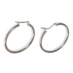 Sleek and beautiful these big earrings by Marianela Vargas are classic in style. The Andean artisan crafts gleaming hoops of polished sterling silver. .925 Sterling silver Classic Sterling Silver Hoop Earrings For Pierced Ears, Classic Silver Huggie Pierced Earrings, Classic Silver Pierced Huggie Earrings, Classic Small Hoop Sterling Silver Earrings, Modern Silver Hoop Earrings With Sterling Clasp, Silver Sterling Huggie Earrings With Shiny Finish, Classic Silver Small Hoop Earrings, Classic Silver Huggie Hoop Earrings, Classic Silver Hoop Earrings With Sterling Clasp