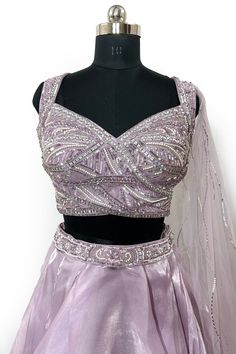 Featuring an Light Purple lehenga in organza base. It is paired with a matching blouse having sequins, cutdana and stone embellishments, including a dupatta. No of Components: 2 Components: Blouse, Lehenga Pattern: Embroidery Type of Work: Cutdana, Sequin Sleeve Type: Sleeveless Fabric: Organza Color: Light Purple Length: 44 inches Blouse: Padded Net dupatta Occasion: Destination Wedding Note:- Originally Stitched in 40 but can alter for size 38 without any extra cost.