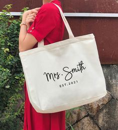 a woman carrying a personalized tote bag