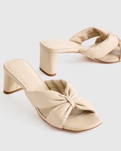 Elevate your style with these Italian Leather Twist Mid Heel Mules. Crafted from luxurious Italian leather, these mules feature a unique twist detail for a modern and sophisticated look. The mid heel provides just the right amount of height for all-day comfort, making them perfect for both casual and dressy occasions. Slip into these chic mules and step out in style wherever you go.  | Quince | Women's Italian Leather Twist Mid Heel Mule in Almond, Size 10 Elegant Beige Mules For Spring, Chic Round Toe Mules, Chic Beige Mules For Spring, Chic Beige Mules With Wrapped Heel, Chic Beige Mules With Sculpted Heel, Chic Beige Sandals With Sculpted Heel, Chic Beige Sandals With Wrapped Heel, Elegant Leather Heels For Day Out, Feminine Leather Mules For Spring