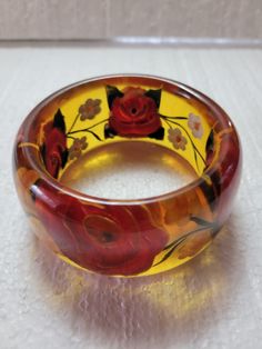 Translucent Big Flowers Bakelite Bangle 4.16 oz 1.50" wide 2.50" I.D. 3 1/4" O.D. Tested Lucite Bangle Bracelet As Gift, Lucite Bangle Bracelets As Gift, Lucite Bangle Bracelet For Gift, Clear Bangle Jewelry For Formal Occasions, Clear Bangle For Formal Occasions, Bakelite Bangles, Big Flowers, Bangle Bracelets, Give It To Me