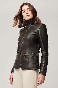 The Jessica leather jacket means business. Crafted from smooth, durable cowhide leather, this zip-front jacket is sleek, stylish, and commanding, featuring double front-zip pockets, leather straps and buckles at the rear waist, and quilting accents throughout to lend a hint of edge. Fully lined for all-day comfort. Wife Outfits, Moto Jacket Style, Women Leather Jacket, Flamboyant Gamine, Stylish Leather Jacket, Collection Ideas, Leather Clothing, Leather Jacket Style, Women Coats