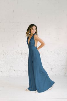 Create a fashion statement with our versatile multiposition jumpsuit, perfect for bridesmaids or any special occasion. This elegant party outfit can be styled in multiple ways to suit any body type or personal style. The jumpsuit features a flattering silhouette with a cinched waist and wide-leg  pants for more elegance. Made from high-quality, comfortable fabric, this jumpsuit will keep you looking chic and feeling confident all night long. Whether you're dancing the night away at a wedding or Elegant Party Outfit, Elegantes Party Outfit, Bridesmaids Jumpsuits, Infinity Dress Bridesmaid, Bridesmaid Proposals, Wide Leg Palazzo Pants, Elegant Party, Bridesmaid Proposal, Bridesmaids Gifts