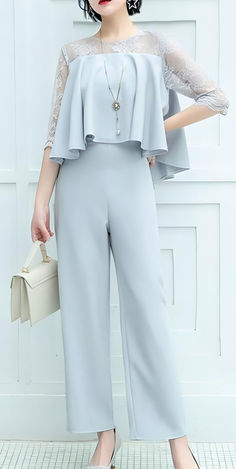 Discover the perfect blend of elegance and comfort with this light gray jumpsuit. Ideal for weddings, business luncheons, and evening gatherings, this versatile piece features delicate lace sleeves and a flattering silhouette. Shop now for an outfit idea that combines timeless style with modern comfort. Elegant Solid Color One-piece Jumpsuit, Elegant Solid Color One-piece Jumpsuit Or Romper, Elegant Solid Color One-piece Jumpsuits And Rompers, Elegant One-piece Jumpsuits And Rompers In Solid Color, Elegant One-piece Jumpsuit For Work, Elegant One-piece Jumpsuits And Rompers For Work, Elegant Solid Color Jumpsuits And Rompers For Spring, Elegant Light Blue Jumpsuits And Rompers For Summer, Elegant Light Blue Jumpsuits And Rompers For Party