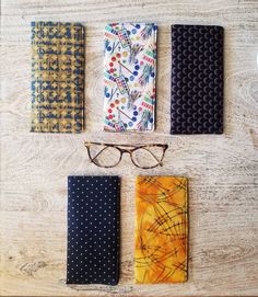 "These fun fabric eyeglass pouches are made with 100% cotton fabric and lined with a complimentary solid color. Each case features protective padding and a velcro closure. The eyeglass pouch measures approximately 7\"x3.5\" and will also fit some sunglasses depending on shape and size.  *Please note that due to these being handmade with love the positioning of the print may vary from pictured. **Glasses not included" Glasses Cases, Fun Fabric, Planner Pens, Pen Pouch, Eye Wear Glasses, Glasses Case, Eyewear Sunglasses, Pencil Case, Columbus