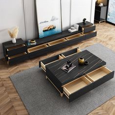 two coffee tables with drawers on each side in front of a large screen television set