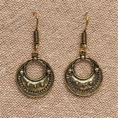 These crescent moon drop earrings feature an eye-catching design with an added beaded detailing. Great for everyday wear! ⚬ Drop 4cm ⚬ Hook Closure ⚬ Weight 3g (each) ⚬ Recycled Pure Brass ⚬ Nickel Free and Hypoallergenic ⚬ Handcrafted by Artisans in Pushkar, India ⚬ Sold as a Pair ♡ Treat yourself or gift that special someone. Each pair comes perfectly packaged in a charming OMishka branded pouch. Have a question? Please message me ♡ Vintage Crescent Moon Charm Earrings, Crescent Shaped Festival Earrings, Metal Crescent Earrings For Festival, Crescent Metal Earrings For Festivals, Vintage Crescent Nickel-free Earrings, Elegant Crescent Earrings For Festival, Elegant Crescent Shaped Festival Earrings, Bronze Crescent Metal Earrings, Brass Jewellery Handmade